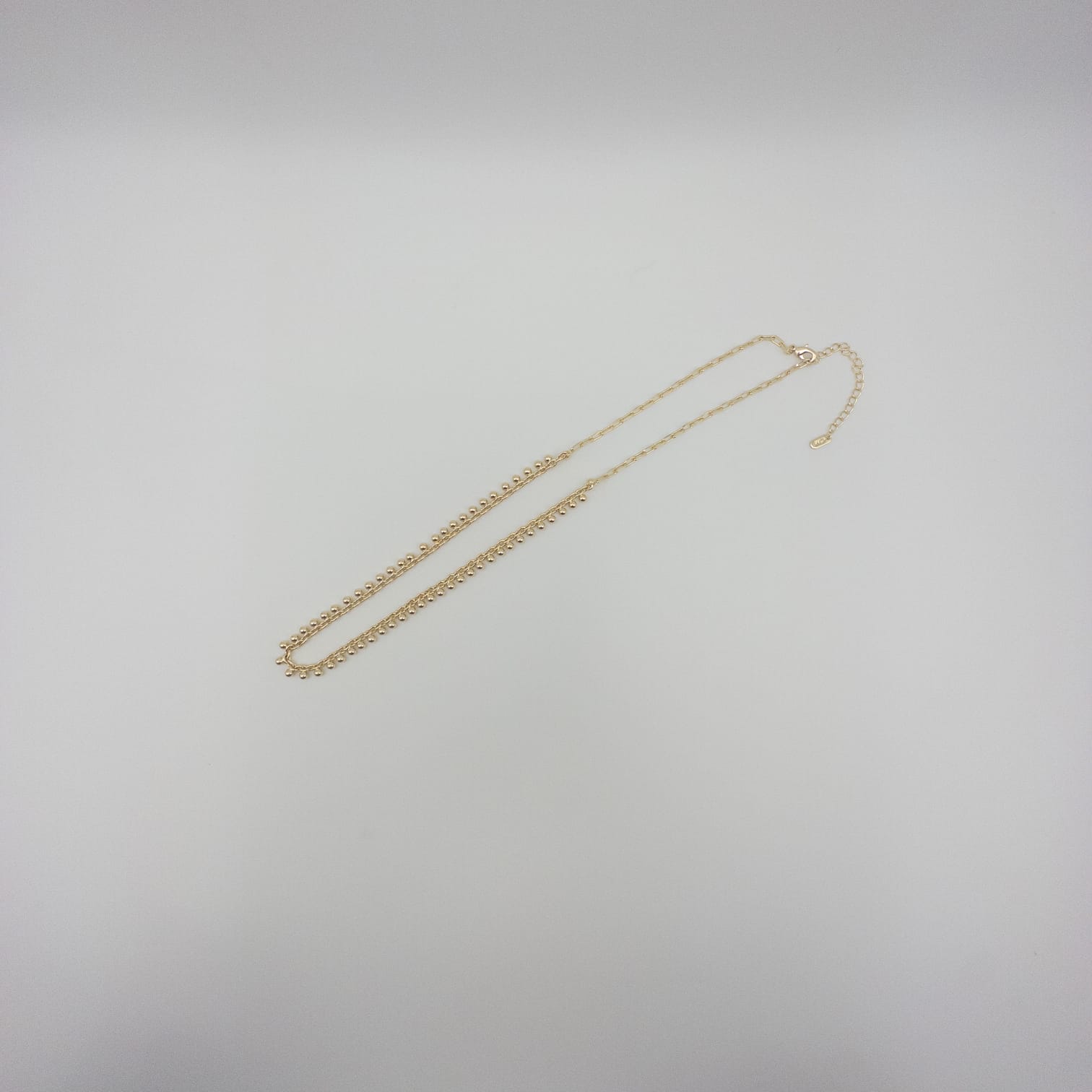 Elegante Goldfarbene Perlenkette Mit Feinem Kugel-Gliederdesign