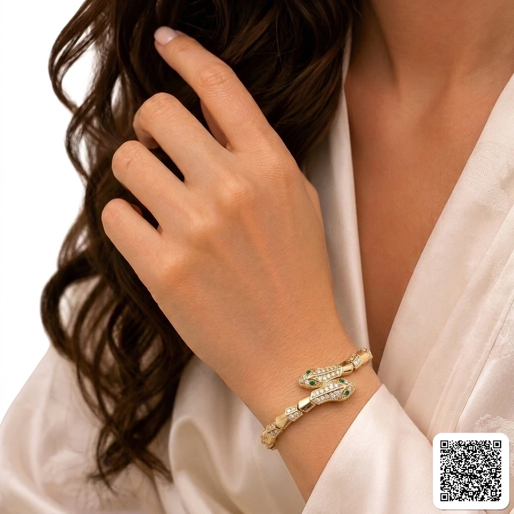 Elegantes Goldfarbenes Armband Mit Strass Und Grünem Stein