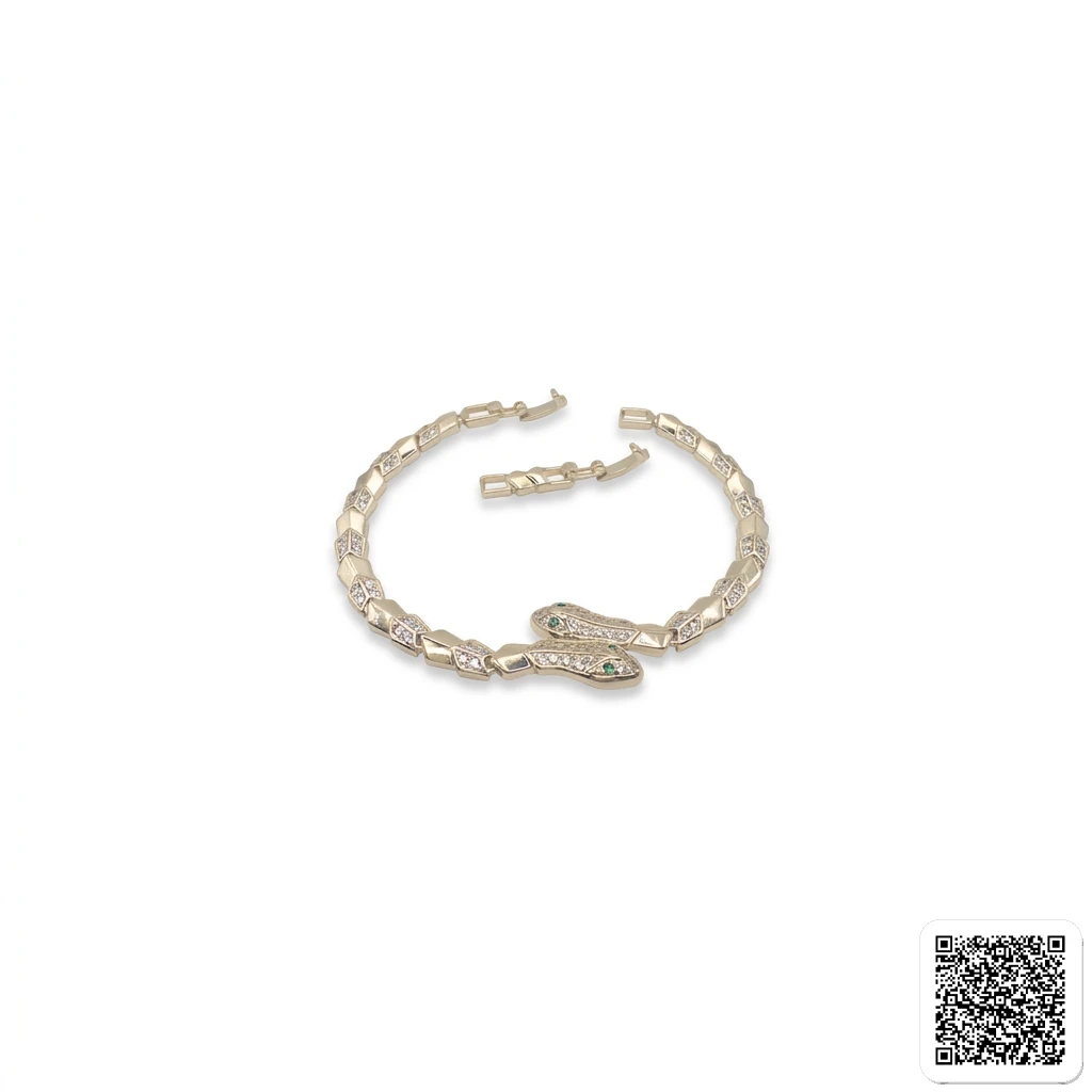 Elegantes Goldfarbenes Armband Mit Strass Und Grünem Stein